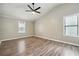 Spacious bedroom with hardwood floors and ceiling fan at 5271 Kelleys Mill Cir, Stone Mountain, GA 30088