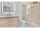 Bathroom with light wood vanity and patterned shower at 8120 Turnberry Way, Duluth, GA 30097