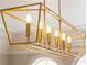 Modern gold chandelier with eight lights at 8120 Turnberry Way, Duluth, GA 30097