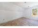 Unfinished bedroom with large window and wood flooring at 1870 Chartwell Trce, Stone Mountain, GA 30087