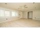 Spacious living room with light hardwood floors and a ceiling fan at 1552 Todd Ln, Lilburn, GA 30047