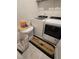 Convenient laundry room with washer, dryer, and storage at 1702 Villageside Ct, Lawrenceville, GA 30043