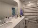 Clean bathroom with double vanity, shower/tub combo, and updated fixtures at 1702 Villageside Ct, Lawrenceville, GA 30043