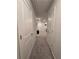 A long hallway with carpet and doors leading to rooms at 1702 Villageside Ct, Lawrenceville, GA 30043