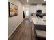 Modern kitchen with white cabinets, hardwood floors, and an island at 1702 Villageside Ct, Lawrenceville, GA 30043