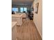 Open concept living room with hardwood floors and a view of the kitchen at 1702 Villageside Ct, Lawrenceville, GA 30043