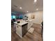 Modern kitchen with stainless steel appliances and an island at 1702 Villageside Ct, Lawrenceville, GA 30043