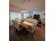 Dining room with a wooden table and comfortable seating at 1702 Villageside Ct, Lawrenceville, GA 30043