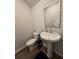 Clean and modern bathroom with pedestal sink and toilet at 1702 Villageside Ct, Lawrenceville, GA 30043