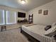 Bedroom with a bed, TV, and ample space for storage at 1702 Villageside Ct, Lawrenceville, GA 30043