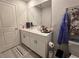 Clean bathroom with white cabinets and a tiled floor at 1702 Villageside Ct, Lawrenceville, GA 30043