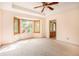 Main bedroom features a bay window and ceiling fan at 175 Carriage Gate Dr, Sharpsburg, GA 30277