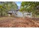 House back view, showcasing a deck and fenced backyard at 175 Carriage Gate Dr, Sharpsburg, GA 30277