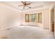 Large main bedroom with a bay window and ceiling fan at 175 Carriage Gate Dr, Sharpsburg, GA 30277
