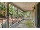 Covered porch with railing overlooking backyard at 175 Carriage Gate Dr, Sharpsburg, GA 30277