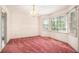 Dining room with bay window and pink carpet at 175 Carriage Gate Dr, Sharpsburg, GA 30277