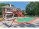 Relaxing pool area with a hammock and plenty of patio space at 1515 Lake Forest Ln, Mcdonough, GA 30253