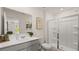Clean bathroom with a shower, toilet and vanity at 584 Silver Moon Dr, Loganville, GA 30052
