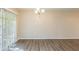 Bright dining room with wood-look floors and sliding glass door at 2465 Timberly Se Dr, Marietta, GA 30060