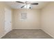 Well-lit bedroom with ceiling fan and neutral carpeting at 2465 Timberly Se Dr, Marietta, GA 30060