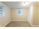 Simple bedroom with neutral walls, carpet flooring, and built-in closet at 2465 Timberly Se Dr, Marietta, GA 30060