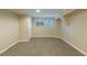 Finished basement room with neutral walls and carpet flooring at 2465 Timberly Se Dr, Marietta, GA 30060