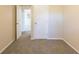 Simple bedroom with carpet flooring and an open door at 2465 Timberly Se Dr, Marietta, GA 30060