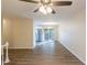Open living room with hardwood floors, ceiling fan, and view of dining area at 2465 Timberly Se Dr, Marietta, GA 30060