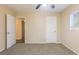 Bedroom with neutral carpeting, ceiling fan and access to another room at 2465 Timberly Se Dr, Marietta, GA 30060