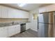 Modern kitchen with stainless steel appliances and granite countertops at 2465 Timberly Se Dr, Marietta, GA 30060