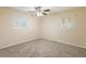 Spacious bedroom with ceiling fan and neutral carpeting at 2465 Timberly Se Dr, Marietta, GA 30060