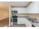 Updated kitchen featuring stainless steel appliances and white cabinets at 2465 Timberly Se Dr, Marietta, GA 30060