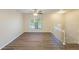 Living room with ceiling fan, large window, and hardwood floors at 2465 Timberly Se Dr, Marietta, GA 30060