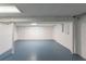 Unfinished basement with light gray painted floor at 2465 Timberly Se Dr, Marietta, GA 30060