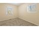 Bright bedroom with neutral walls, carpet flooring, and two windows at 2465 Timberly Se Dr, Marietta, GA 30060