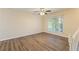 Bright living room with hardwood floors, large window, and ceiling fan at 2465 Timberly Se Dr, Marietta, GA 30060