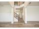 Bright and spacious entryway with high ceilings and elegant staircase at 4203 Shandi Cv, Hoschton, GA 30548