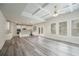 Open concept living area with kitchen and tray ceiling at 4203 Shandi Cv, Hoschton, GA 30548