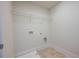 Laundry room with shelving and linoleum flooring at 4203 Shandi Cv, Hoschton, GA 30548