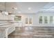 Spacious kitchen with island, stainless steel appliances, and white cabinets at 4203 Shandi Cv, Hoschton, GA 30548