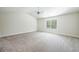 Large bedroom with neutral carpet and abundant natural light at 4203 Shandi Cv, Hoschton, GA 30548