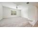 Spacious bedroom with ceiling fan and neutral carpet at 4203 Shandi Cv, Hoschton, GA 30548