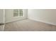 Well-lit bedroom with neutral carpeting and ample space at 4203 Shandi Cv, Hoschton, GA 30548