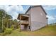 House exterior showcasing the deck and backyard at 4203 Shandi Cv, Hoschton, GA 30548