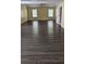 Large bonus room with wood-look floors and two windows at 4160 Post Oak Grv, Atlanta, GA 30349