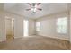 Main bedroom with high ceiling and access to bathroom at 5935 Sarah Orr Ln, Cumming, GA 30040