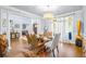 Elegant dining room featuring a stunning chandelier and hardwood floors at 145 Oak Forest Dr, Oxford, GA 30054