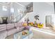 Open living area with sectional sofa, statement art, and modern coffee table at 145 Oak Forest Dr, Oxford, GA 30054