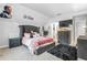 Bedroom with a gray upholstered bed and TV at 145 Oak Forest Dr, Oxford, GA 30054