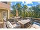 Spacious deck with seating area, fire pit, and wooded views at 145 Oak Forest Dr, Oxford, GA 30054